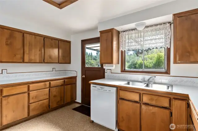 Kitchen with door to covered back deck.