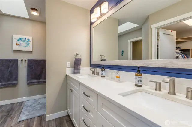 Primary bath has dual sinks, walk-in closet