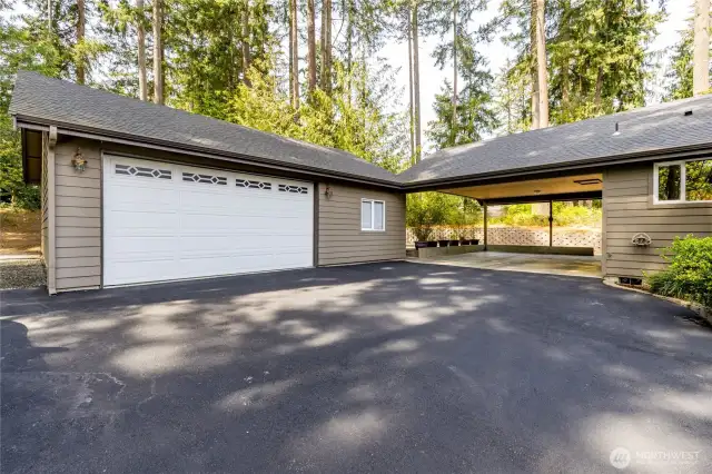2-Car carport connects to the laundry room. 2-Car garage is 24'x32'. EV charging with 50-amp dedicated circuit!