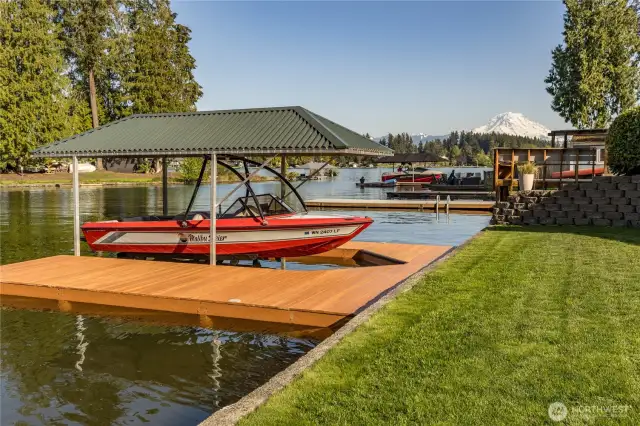 Private dock with covered boat lift. And check out that view of Mt. Rainier!