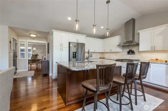 Beautiful finishes throughout - hardwood floors, quartz counters, tiled backsplash