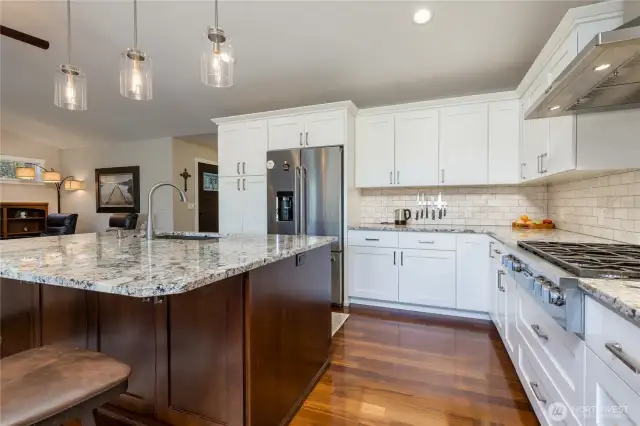 High-end appliances including 6-burner Miele cooktop