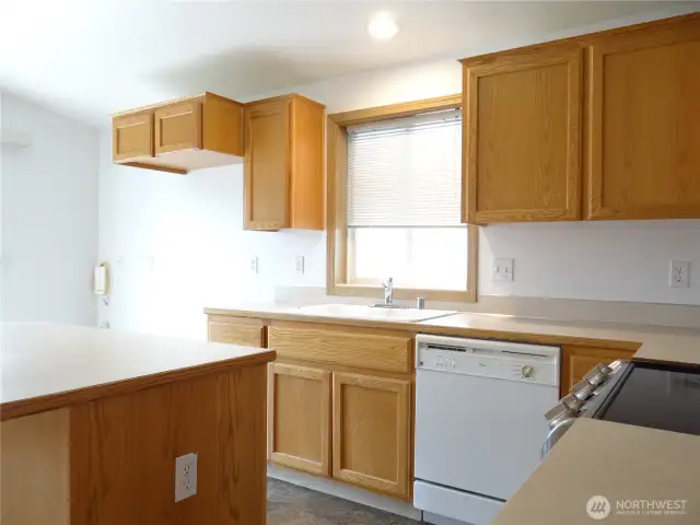 Kitchen to Eating Area and Refrigerator cubby