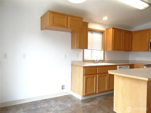 Kitchen to Eating Area and Refrigerator cubby