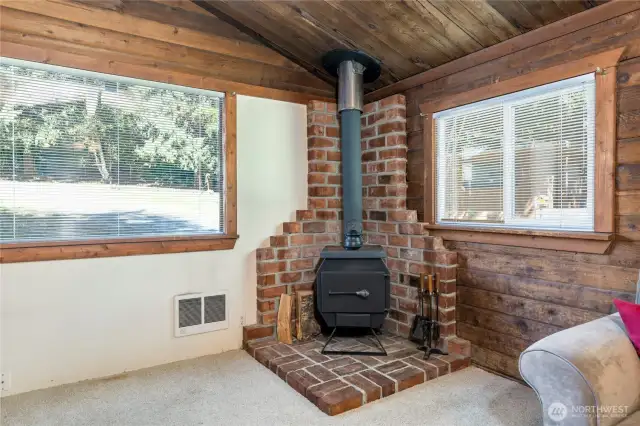 Cozy wood-burning stove. Firewood out back stays with the home!