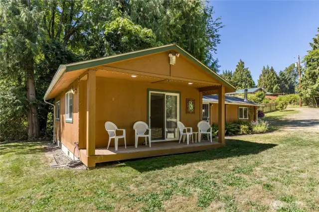 Covered porch off the primary bedroom is perfect for enjoying the serenity of this property!
