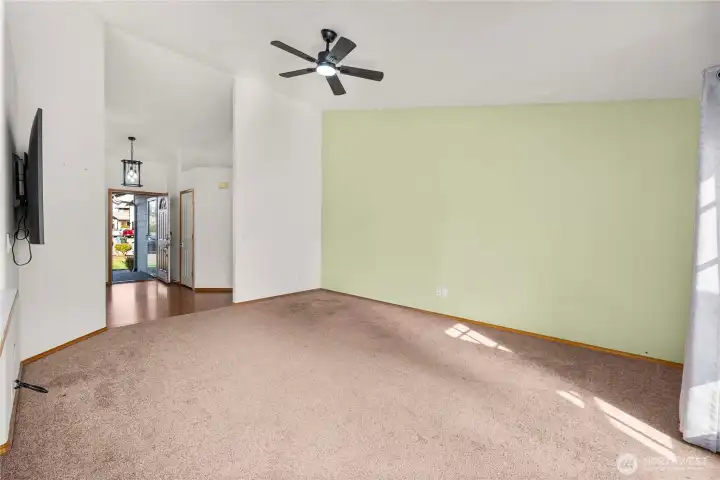 Vaulted ceilings and new ceiling fan right off the kitchen.