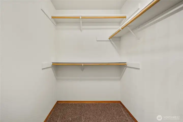 Walk in closet in the primary bedroom