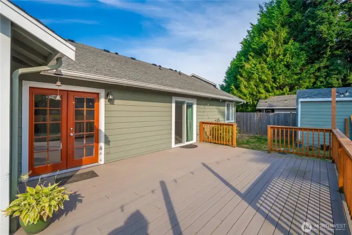 Huge trex deck for easy maintenance. Door leading from the family room and primary bedroom