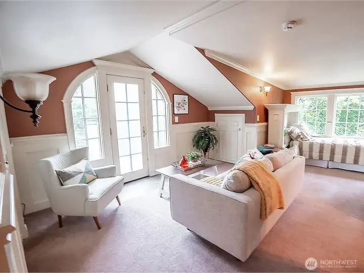 The apartment above the garage has a French door that opens to a deck.