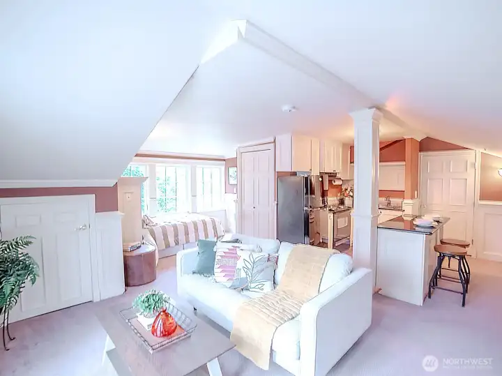 An apartment above the garage is self-contained with a sleeping area, 3/4 bath and kitchen.