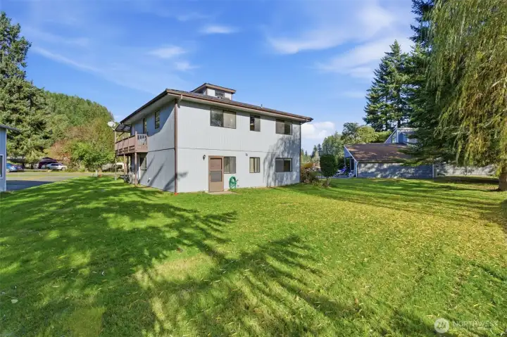 Back of home and backyard