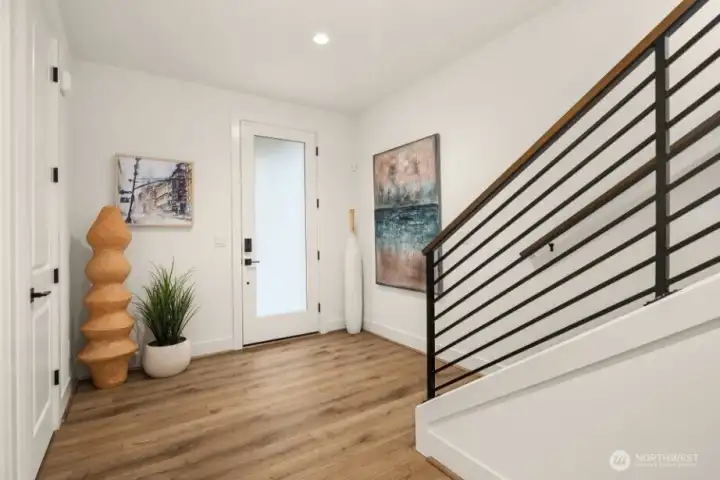 Main floor entry, foyer and Garage access.