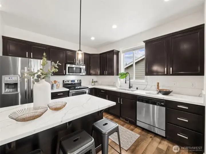 New quartz countertops, sink, faucet and lighting fixtures.