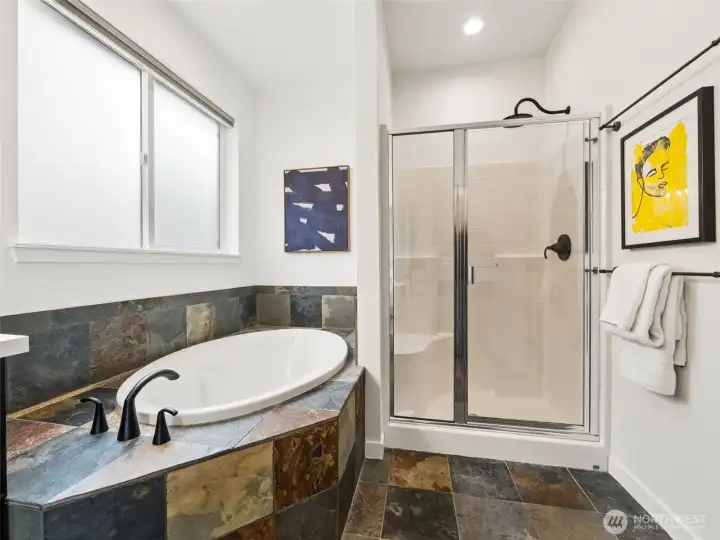 Primary bathroom with a soaking tub and walk in shower