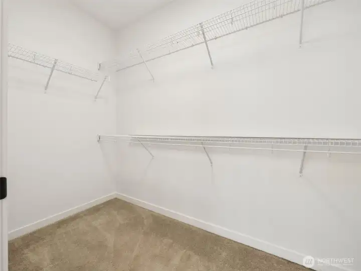 The primary bedroom has a large walk in closet.
