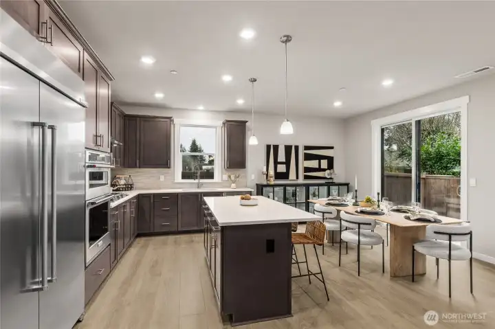 Chef's kitchen with 48" counter depth side by side refrigerator & gas cooktop - you will love cooking in this kitchen!