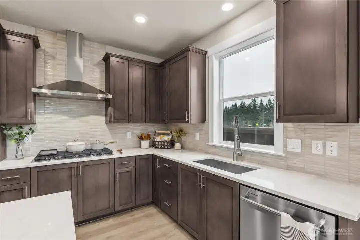 Gas cooktop, love the window at the kitchen sink!