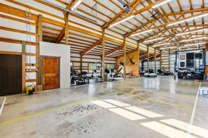 Shopspace provides ample room for all the toys, tack, weight room. Horse stall area, kennel and lots of storage.