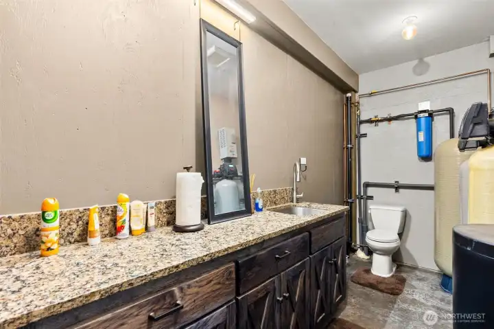 Bath and clean up area in the shop. "Even the shop has granite countertops!"