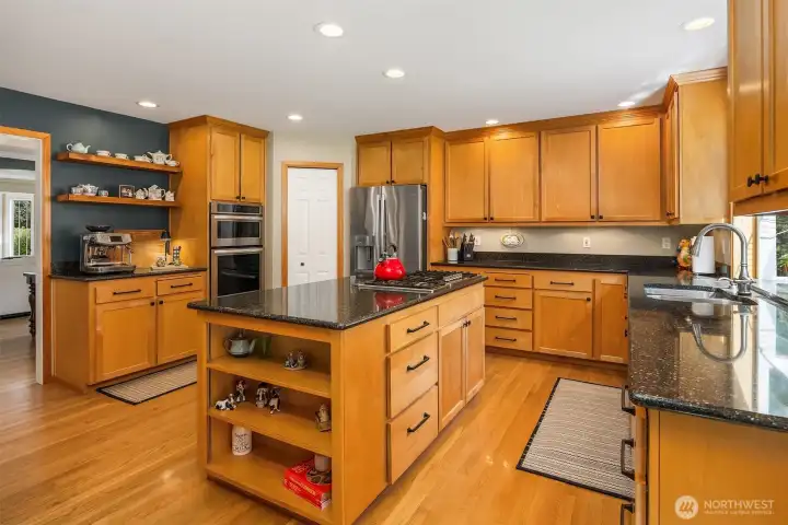 Expansive, open kitchen with cooking island, upgraded appliances and new coffee/beverage bar