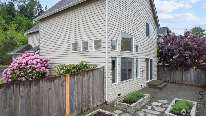 Gardner's delight, raised beds made from stacked stone, and patio for enjoying the outdoors