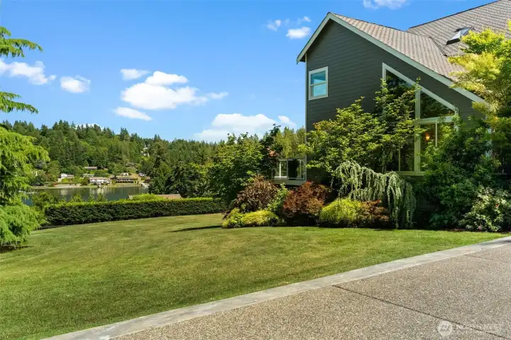 Thoughtfully maintained grounds offer a welcoming approach with glimpses of the water beyond. Thoughtfully maintained grounds offer a welcoming approach with glimpses of the water beyond.
