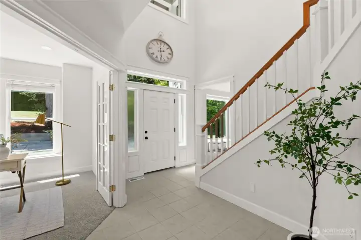 Grand foyer showcases vaulted ceilings, natural light, and a thoughtfully designed layout. Grand foyer showcases vaulted ceilings, natural light, and a thoughtfully designed layout.