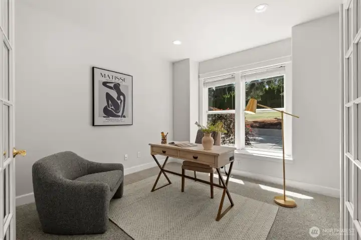 Dedicated office space with large windows and a quiet setting near the entry. Dedicated office space with large windows and a quiet setting near the entry.