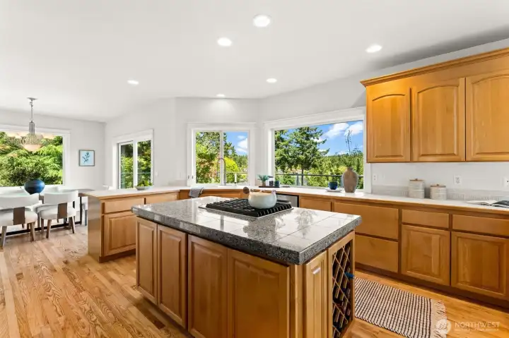 Positioned at the heart of the home, the kitchen enjoys natural light and views from multiple windows. Positioned at the heart of the home, the kitchen enjoys natural light and views from multiple windows.