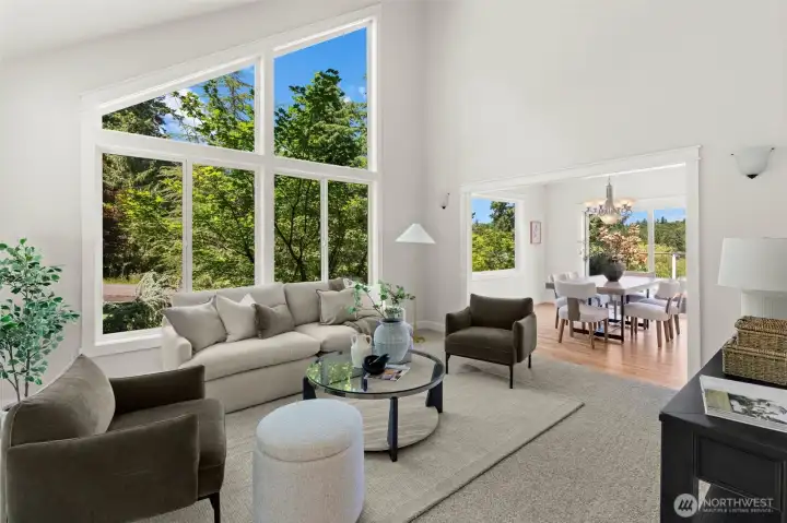Vaulted ceilings and oversized windows create an airy atmosphere in the main living area. Vaulted ceilings and oversized windows create an airy atmosphere in the main living area.