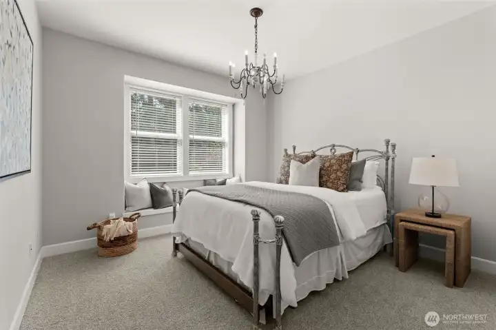 Well-sized bedroom features a large window, neutral finishes, and room for a variety of of furniture arrangements. Well-sized bedroom features a large window, neutral finishes, and room for a variety of of furniture arrangements.