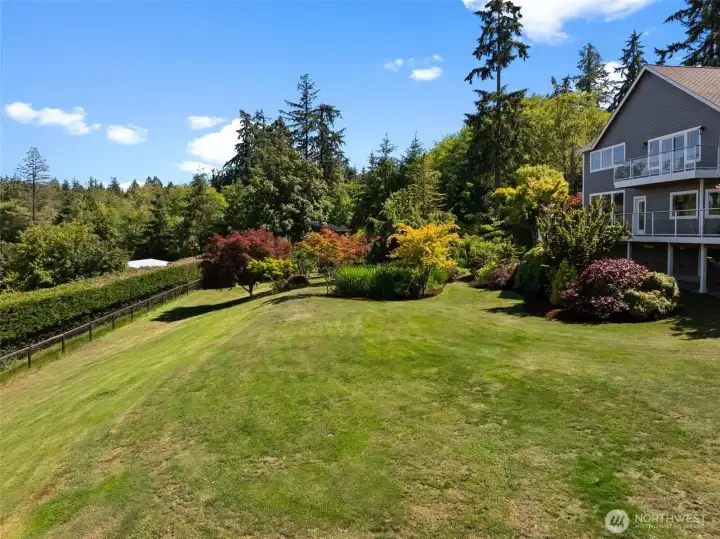 Beautifully maintained grounds feature expansive lawn space, mature trees, and thoughtfully designed landscaping. Beautifully maintained grounds feature expansive lawn space, mature trees, and thoughtfully designed landscaping.