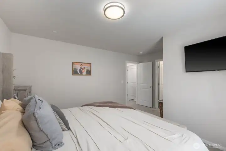 Additional bedroom view highlighting the room's size and connection to the adjoining spaces.