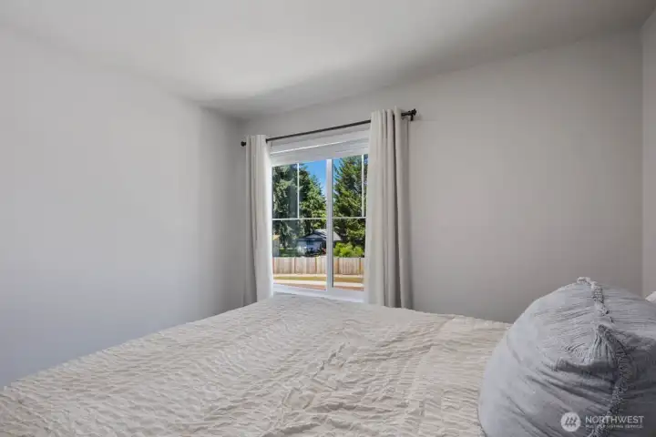 Additional bedroom view showcasing the room layout and window placement.