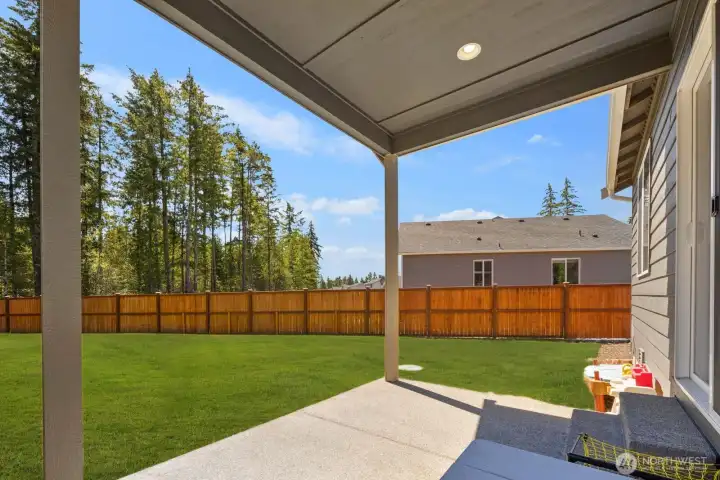 Additional view of the covered patio with direct access to the backyard.