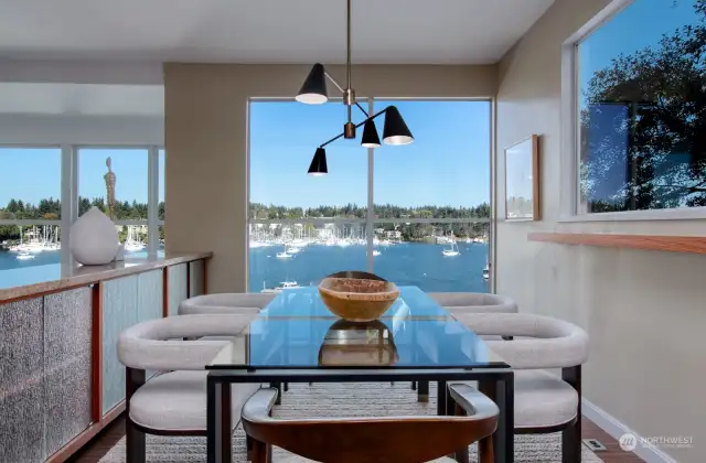 Commanding Eagle Harbor views from dining room (seats 12) with built-in storage.