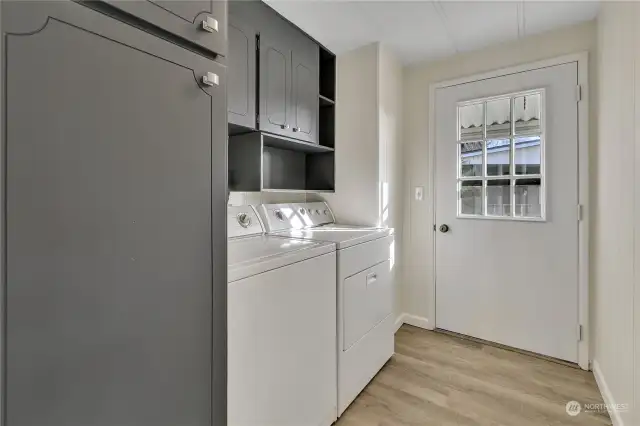 Utility room, full W/D and door to backside of home