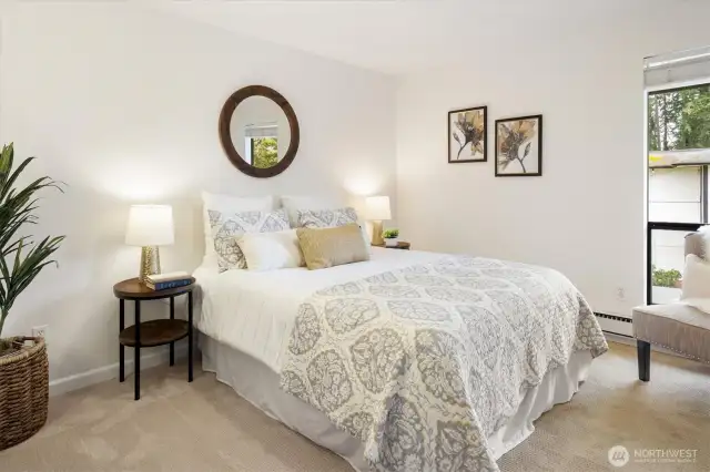 The bedroom feels bigger with nice window providing additional light into the room.