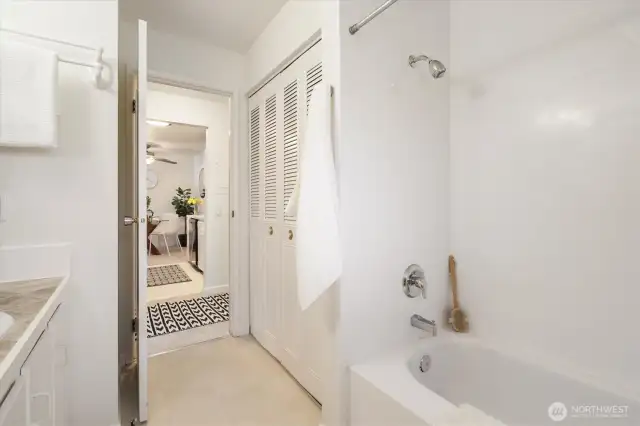 Bathroom off the kitchen and next to the bedroom. In the double closet doors, you will find the new hot water tank. Plus there is additional storage.