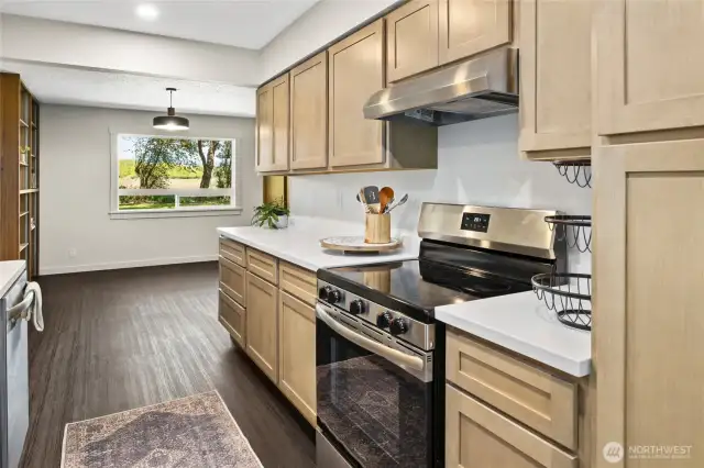 The kitchen is all new with beautiful cabinetry and solid surface countertops!