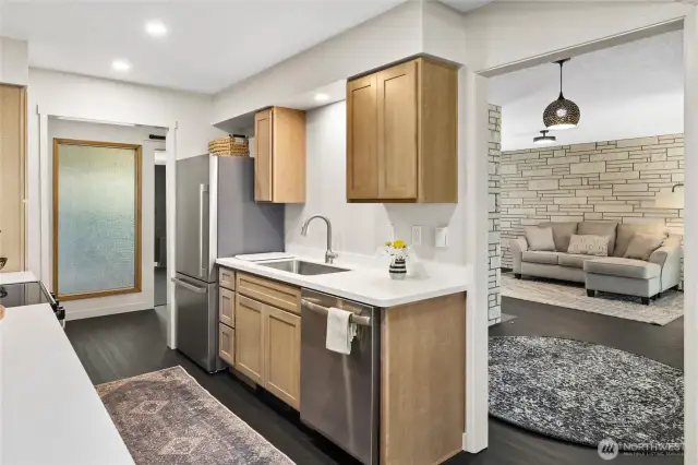 The kitchen is all new with beautiful cabinetry and solid surface countertops!