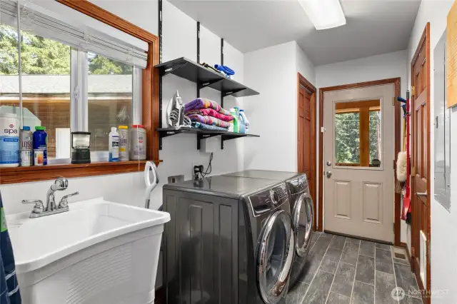 Laundry Room/mudroom also serves as a mud room with a secondary entry from the front porch! Great for snow gear. Washer/Dryer stay. Utility sink set up & good storage too.