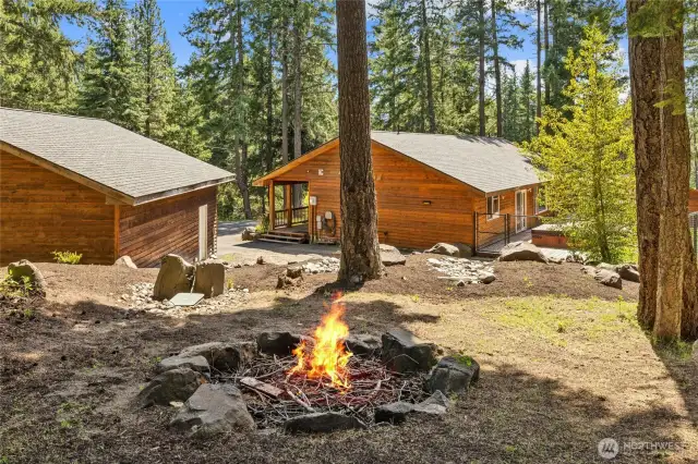 Fire pit area just above the nice water feature! The other side of the cabin has a cute horseshoe pit set up too.