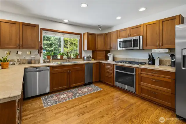 Well allocated kitchen complete with mostly new appliances including trash compactor, garbage disposal & separate wine fridge!
