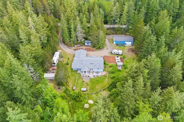 Square and Kitsap Level 2.32 acre parcel with a 1981 sqft stick built home, 2 car garage plus 24 X 48 shop Garen areas, Rv hook ups, fenced yards, etc...