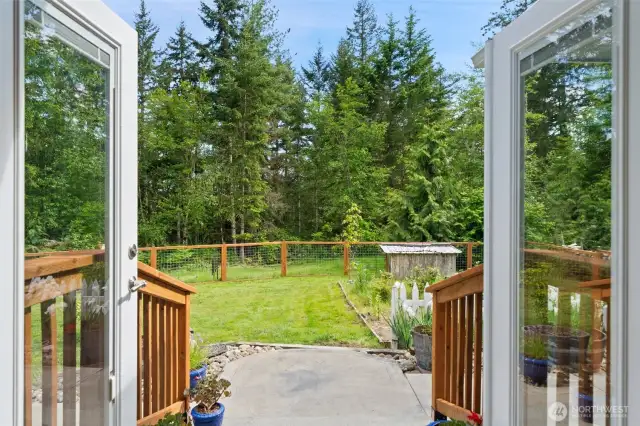 Come on out and enjoy the fenced back yard and patios