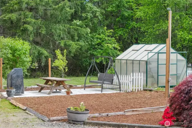Green House and a little sunny spot for a garden.