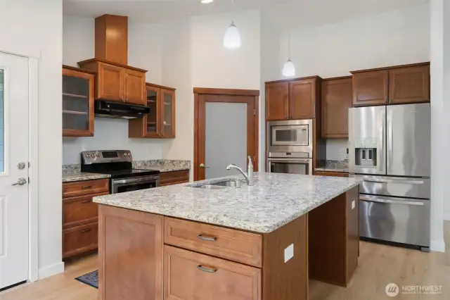 Nice kitchen with walk in pantry, 2 ovens, built in microwave and a large island with lots of space for cooking prep.
