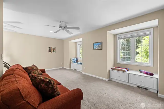 Large bedroom with cozy window seats.